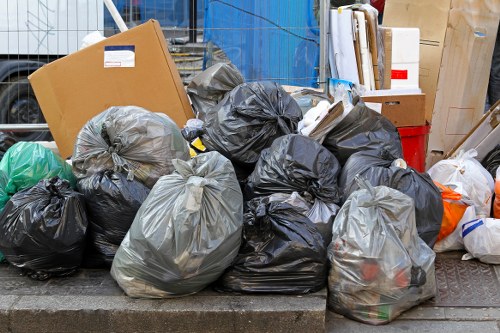 Close-up of garden debris and greenery awaiting clearance at Turnham Green site